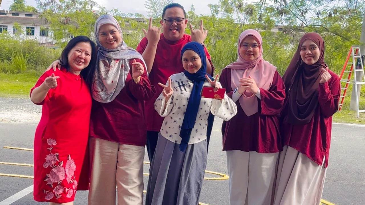 KSL team members celebrating together outdoors